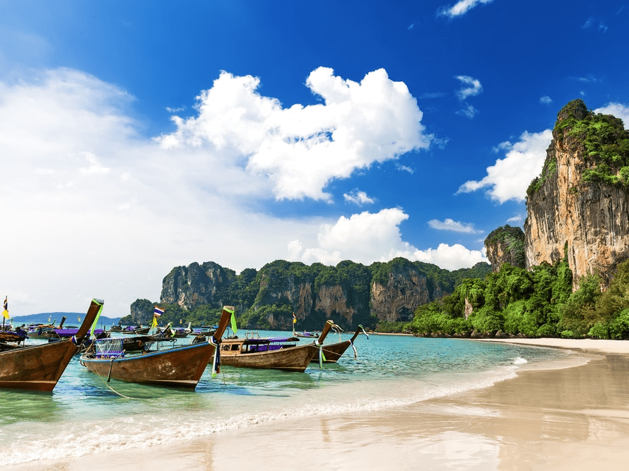 wooden fishing boats on a tropical beach