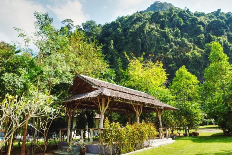 view of large rustic sala in a tropical garden